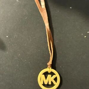 Michael Kors Gold Logo Charm 1.5" X 2.5W/ leather Brown Cord 9"